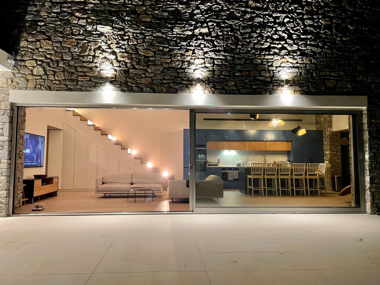 Living room seen from the terrace at night