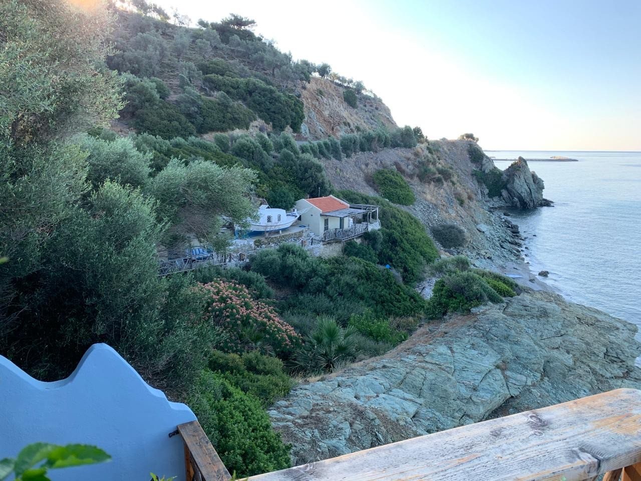 The house on the shoreline seen from along the coast