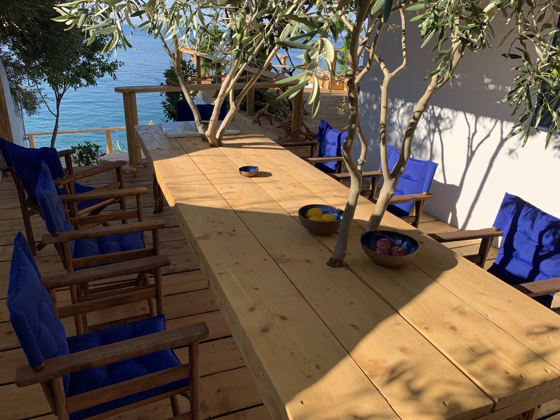 Amodeli Seafront House pergola dining table by the sea