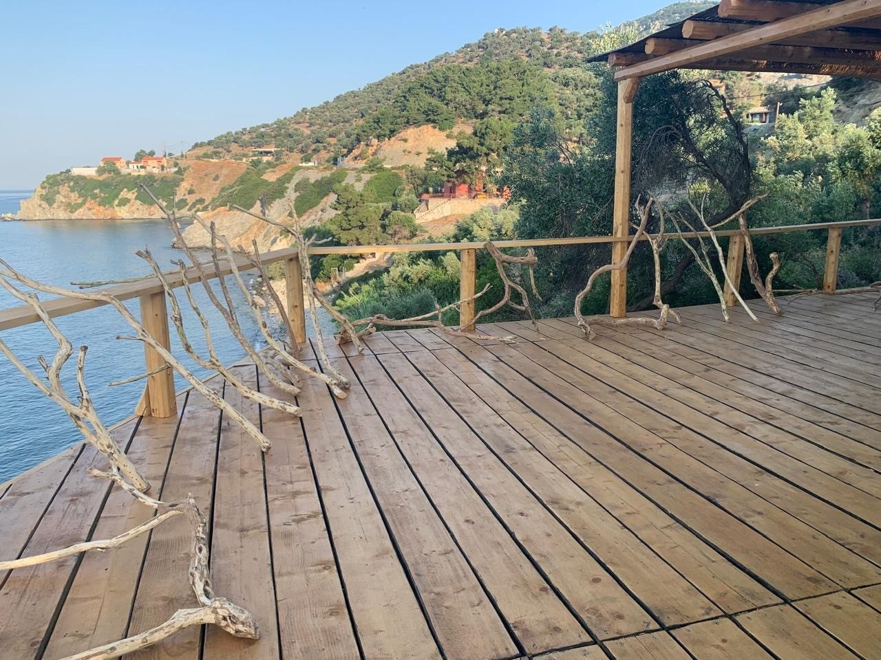 Wide wooden deck opening down the coastline