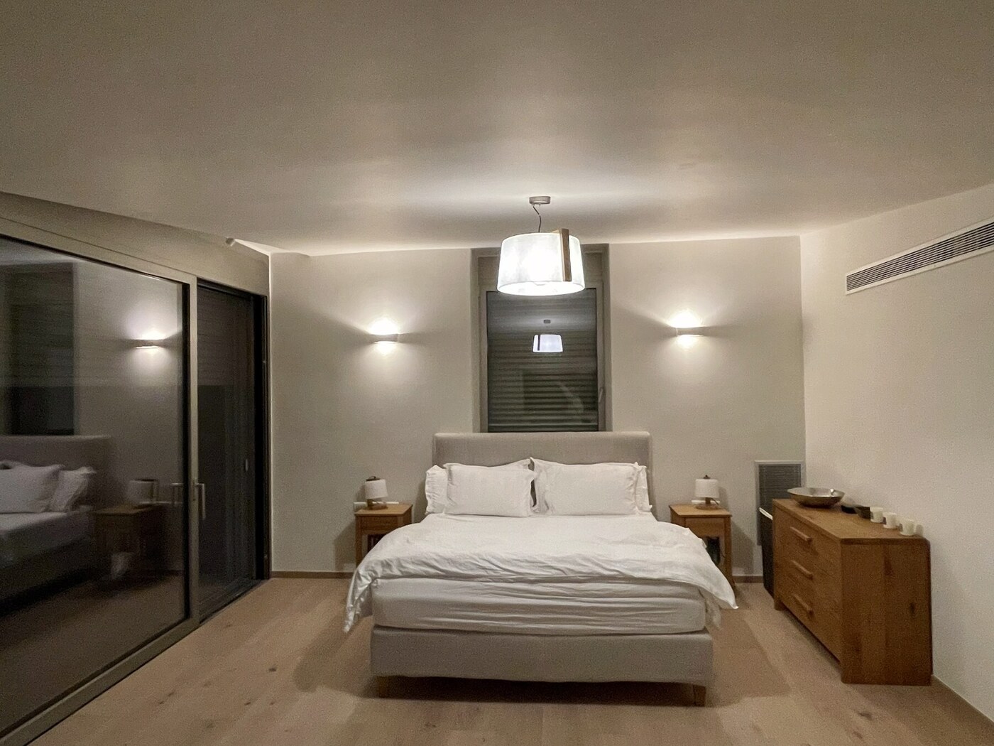 Master suite warmly lit at night
