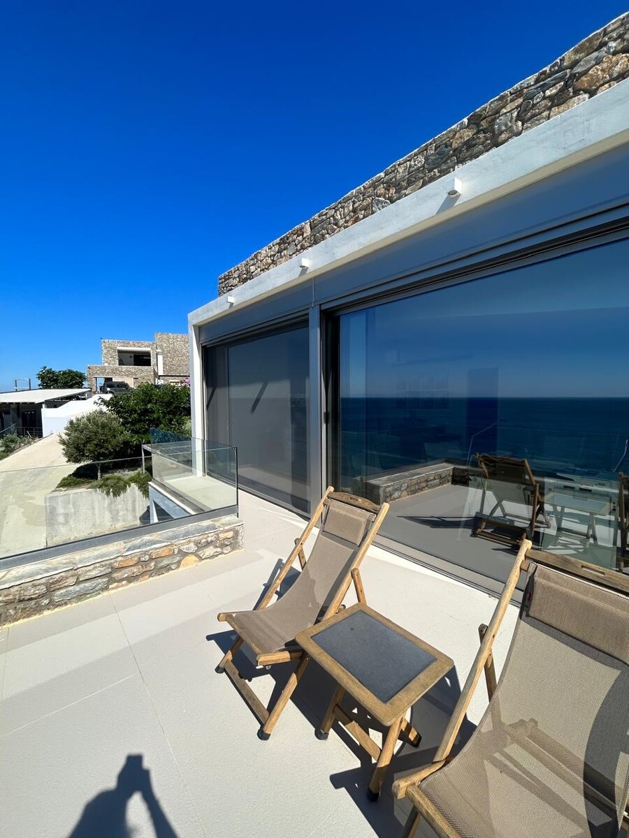 Private balcony of the master suite, with deck chairs and sea view